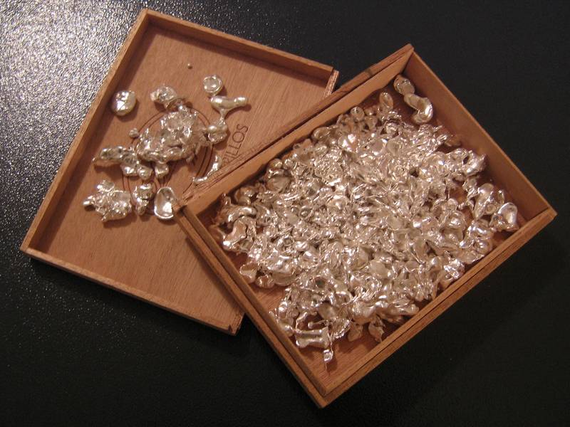 Silver flakes in a wooden box