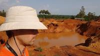 Mr. Louis with open pit in background