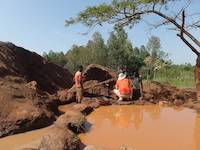 Mr. Louis consulting with local prospectors