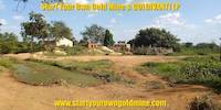 Artisanal mining site and pond of water