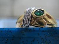 Designed ring with broken gemstone and diamonds