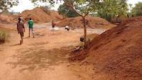 Children panning for gold on mining site