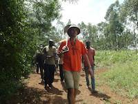 Mr. Louis leading people to the river